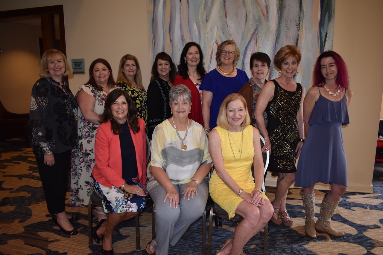 Cypress-Woodlands Junior Forum president Carol Brushwood was recently honored by new president Renee Atkinson for her work 
